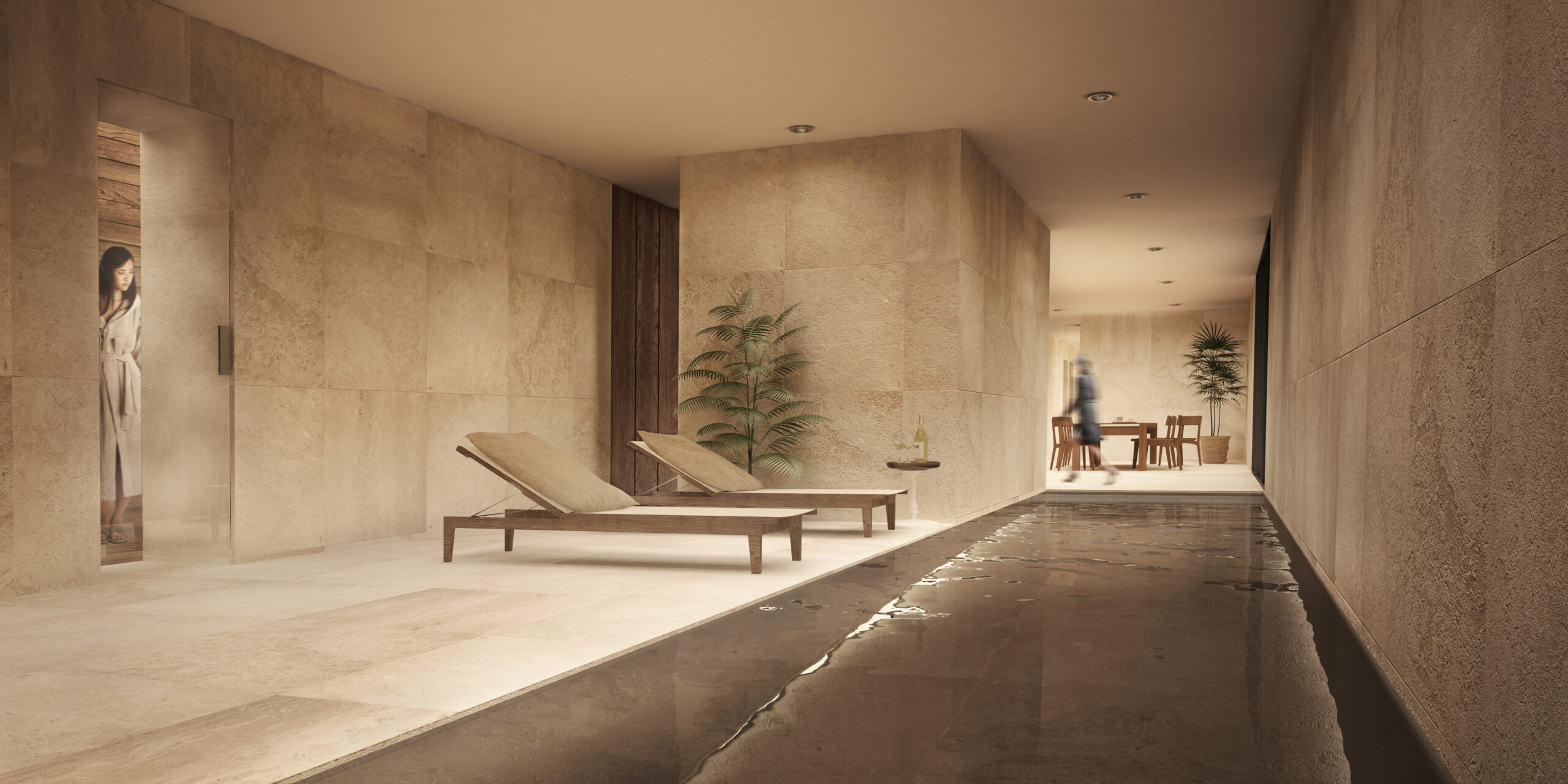 Area relax con lettini affacciata sulla piscina interna e finiture in pietra