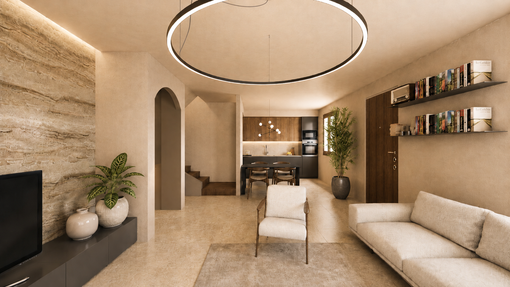 Zona giorno ristrutturata con soggiorno, cucina a vista, parete TV materica e illuminazione circolare sospesa